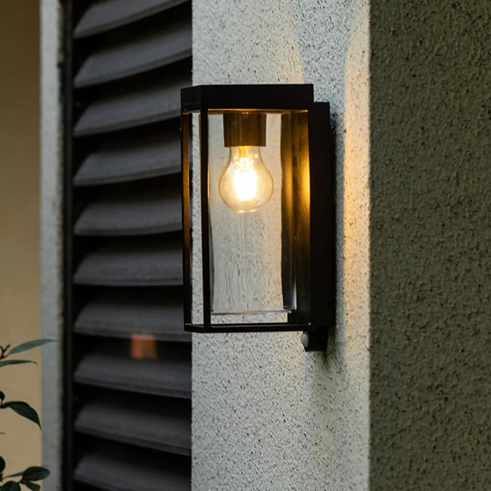 Lámpara de pared exterior con marco de metal negro
