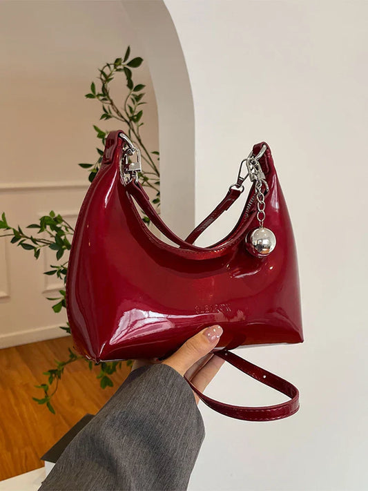 Bolso de mano brillante con cremallera y bandolera