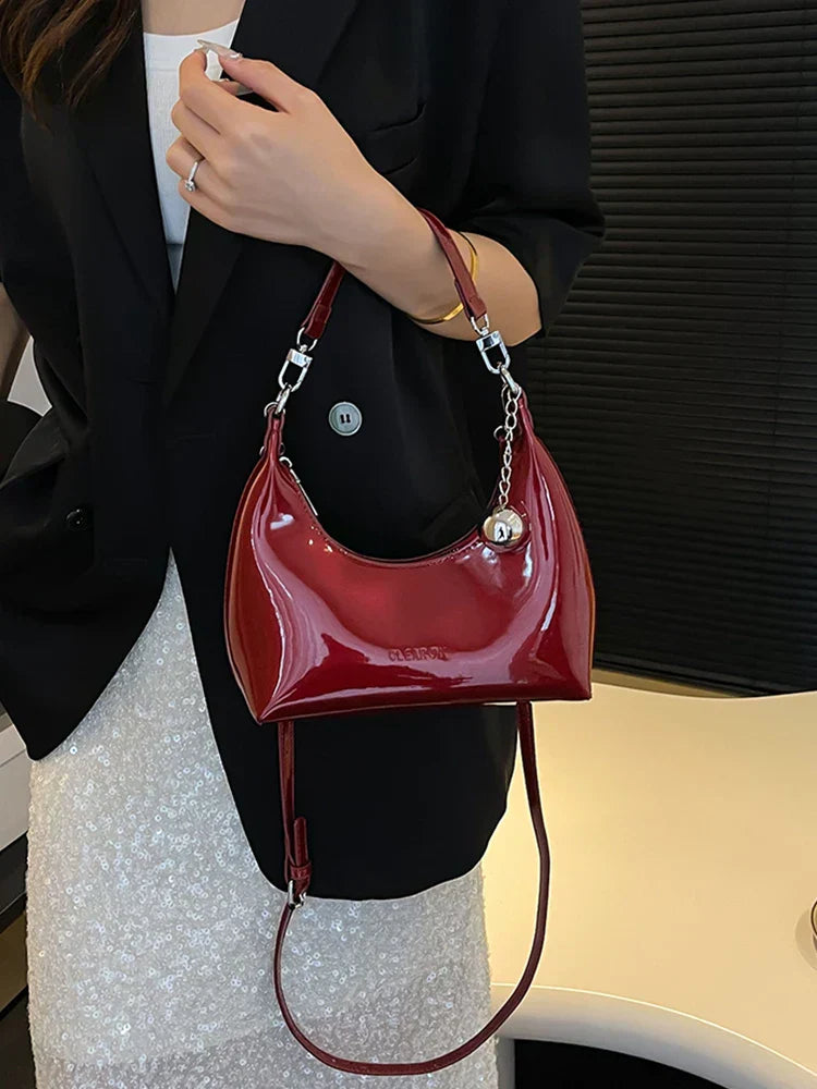 Bolso de mano brillante con cremallera y bandolera