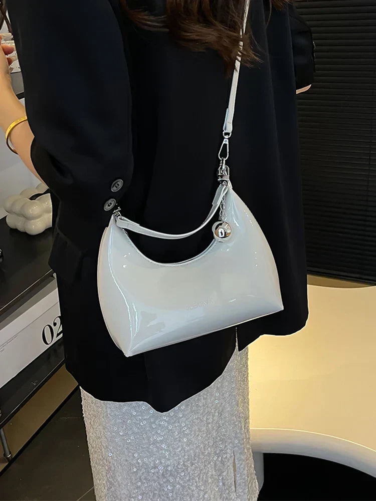 Bolso de mano brillante con cremallera y bandolera