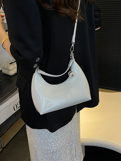 Bolso de mano brillante con cremallera y bandolera