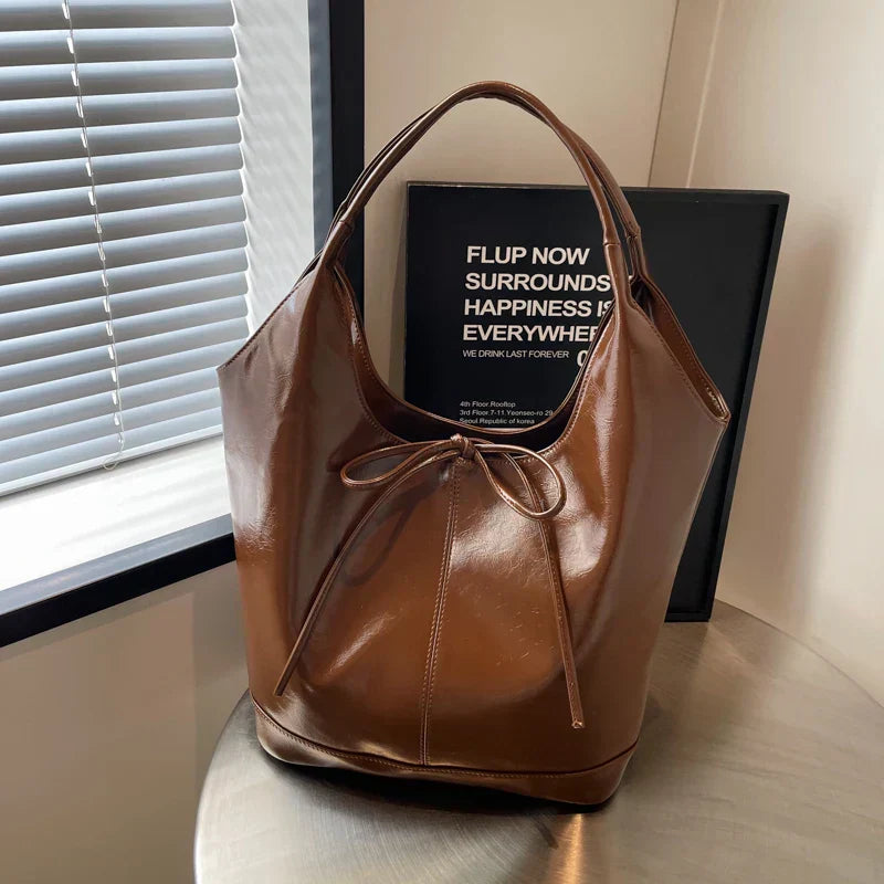Bolsa de mano estilo cinta