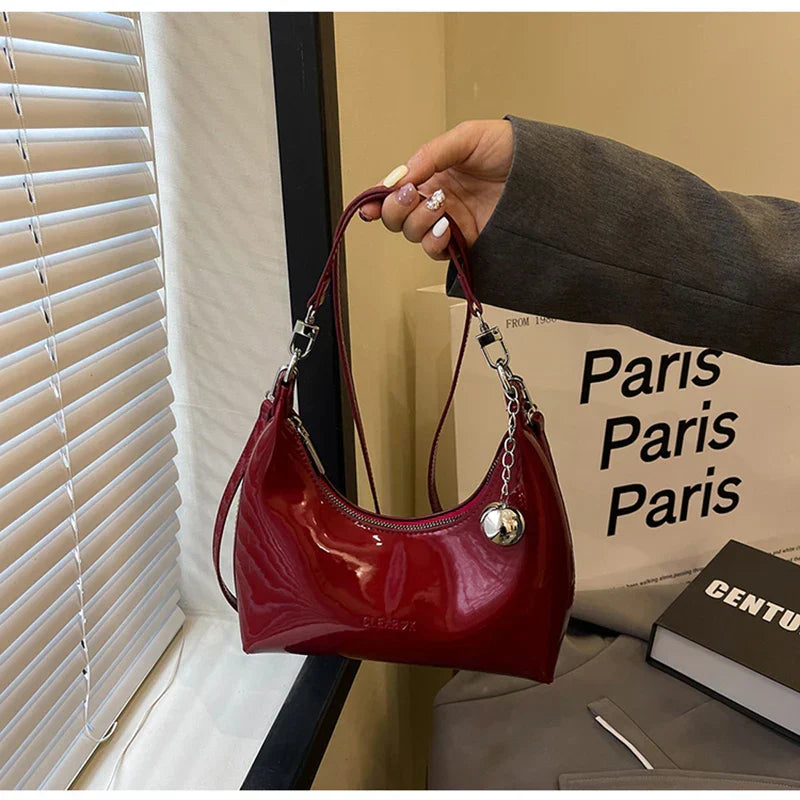 Bolso de mano brillante con cremallera y bandolera