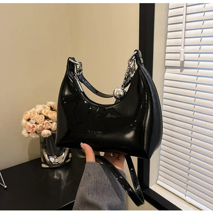 Bolso de mano brillante con cremallera y bandolera