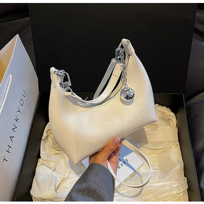 Bolso de mano brillante con cremallera y bandolera