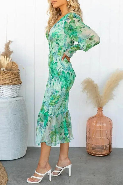 Delilah | Vestido midi floral con volantes