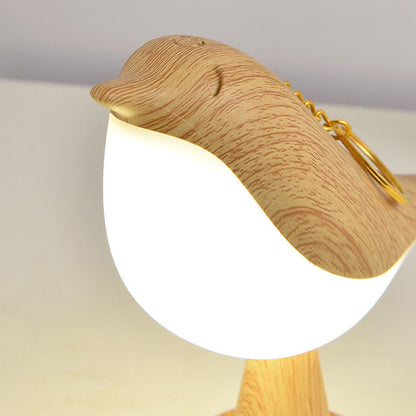 Lámpara de mesa con diseño de pájaro en acabado de madera